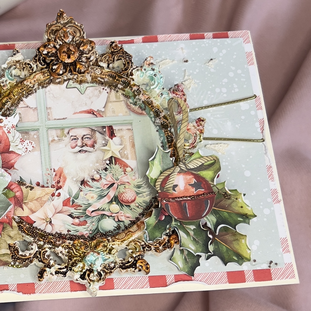 Close-up of Santa Claus and snow detail on a handmade mint and red Christmas card