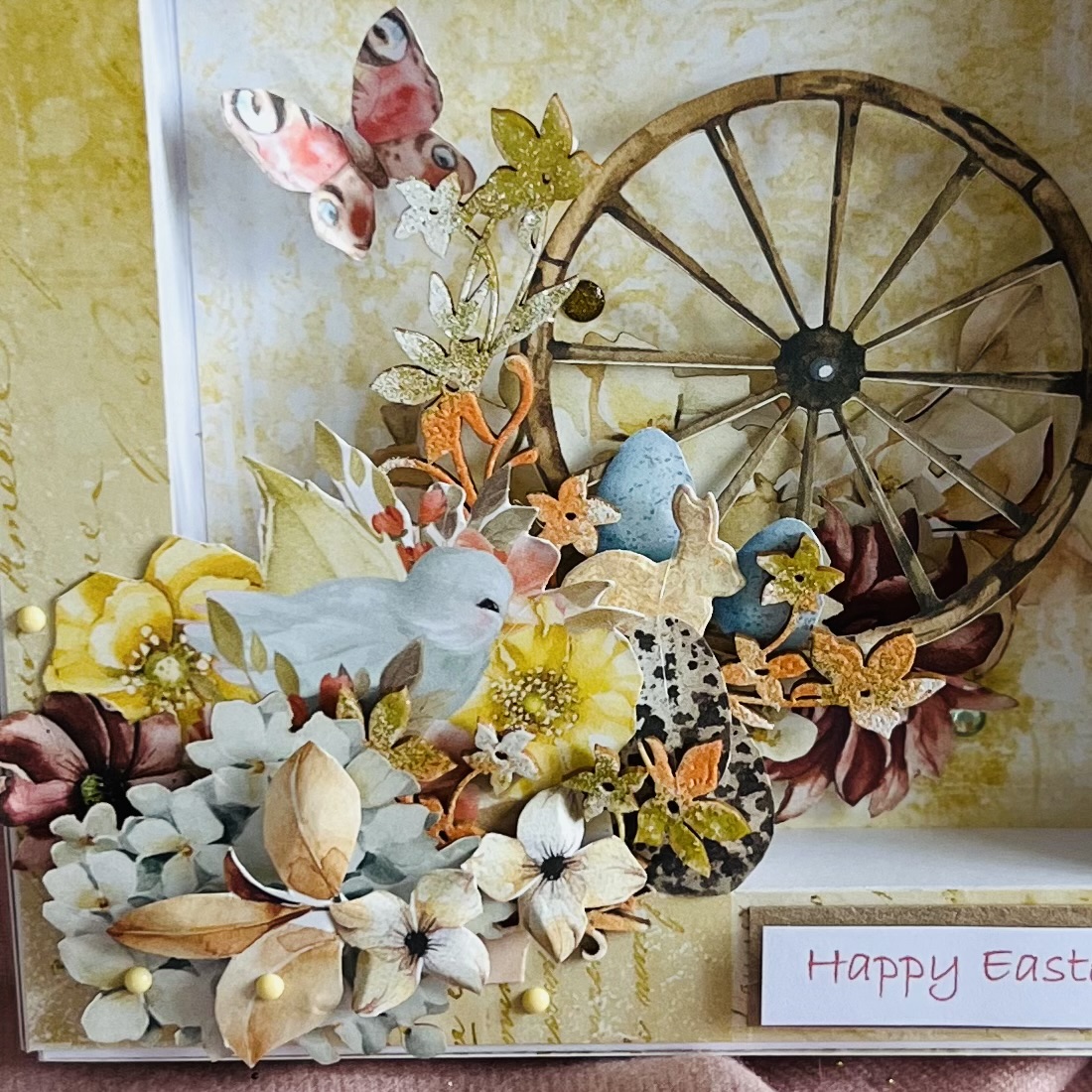 Yellow paper flowers with a chick and a butterfly