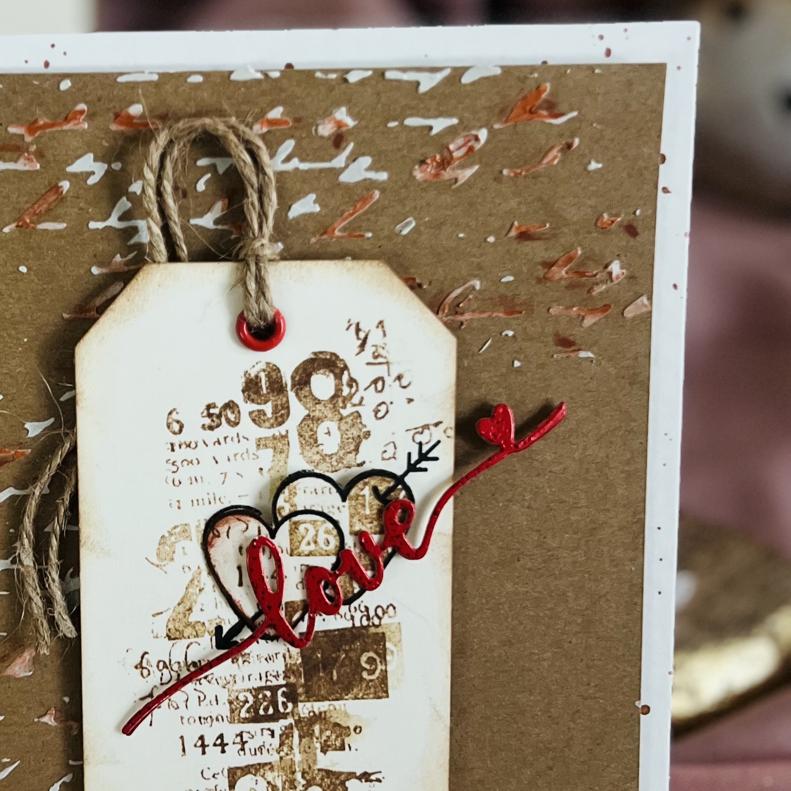 Tag on a card with the inscription "love" in red